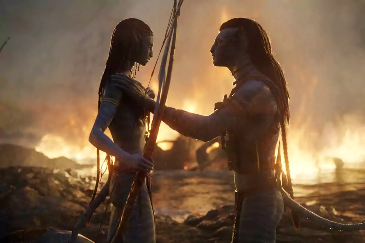 Two blue characters with feline features look at each other against a background of flames and smoke, one holding a bow while the other touches their shoulder. Two blue characters with feline features look at each other against a background of flames and smoke, one holding a bow while the other touches their shoulder.