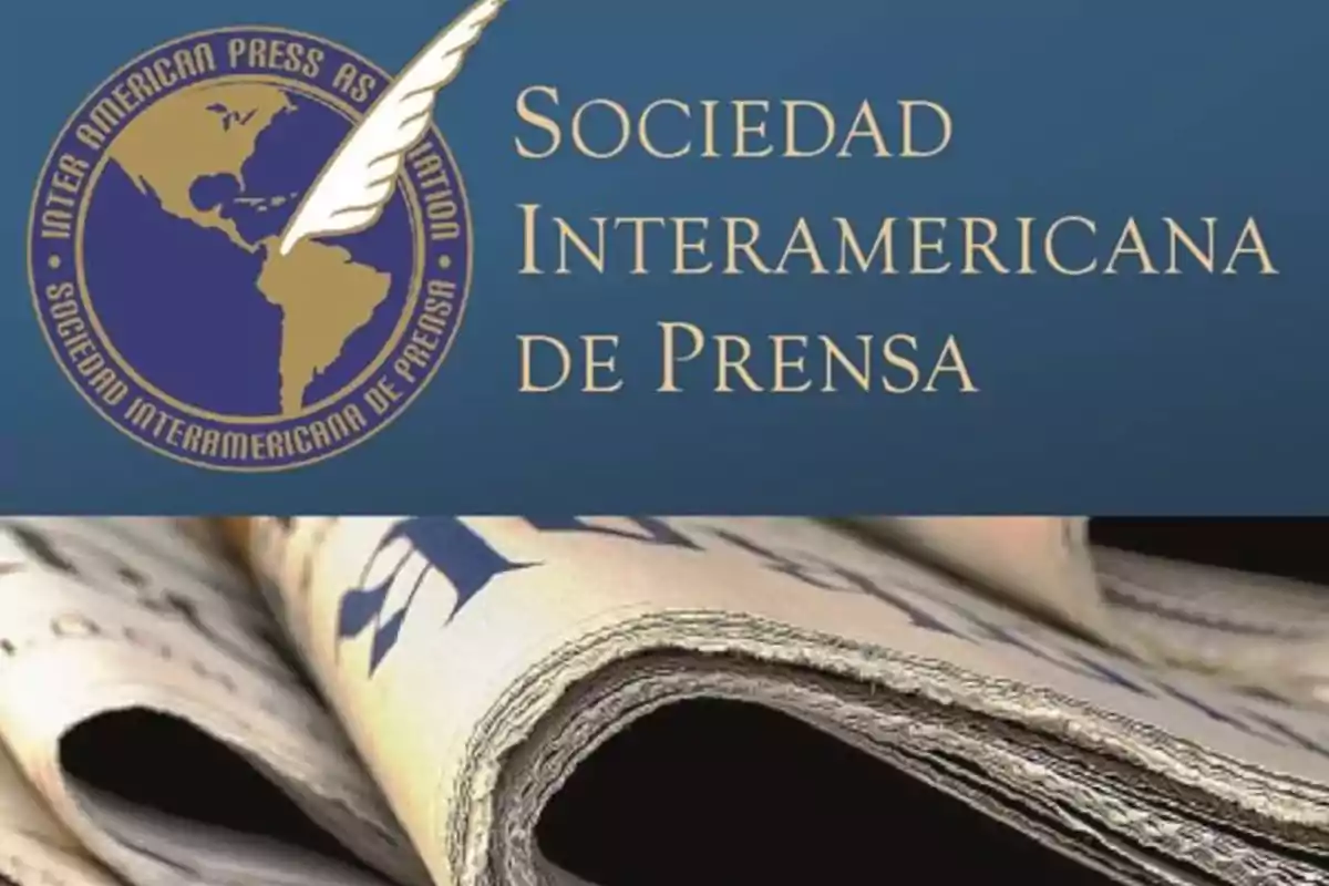 Logo of the Inter American Press Association next to some rolled-up newspapers Logo of the Inter American Press Association next to some rolled-up newspapers