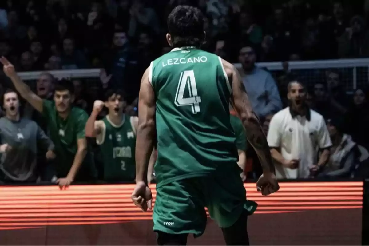 Basketball player wearing number 4 and the name Lezcano on the jersey celebrating in front of an excited crowd