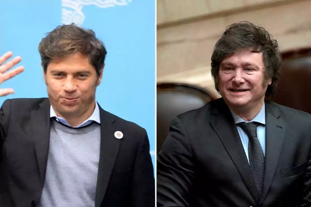 Two men in dark suits, one on the left raising his hand and the other on the right smiling, both in a formal setting.