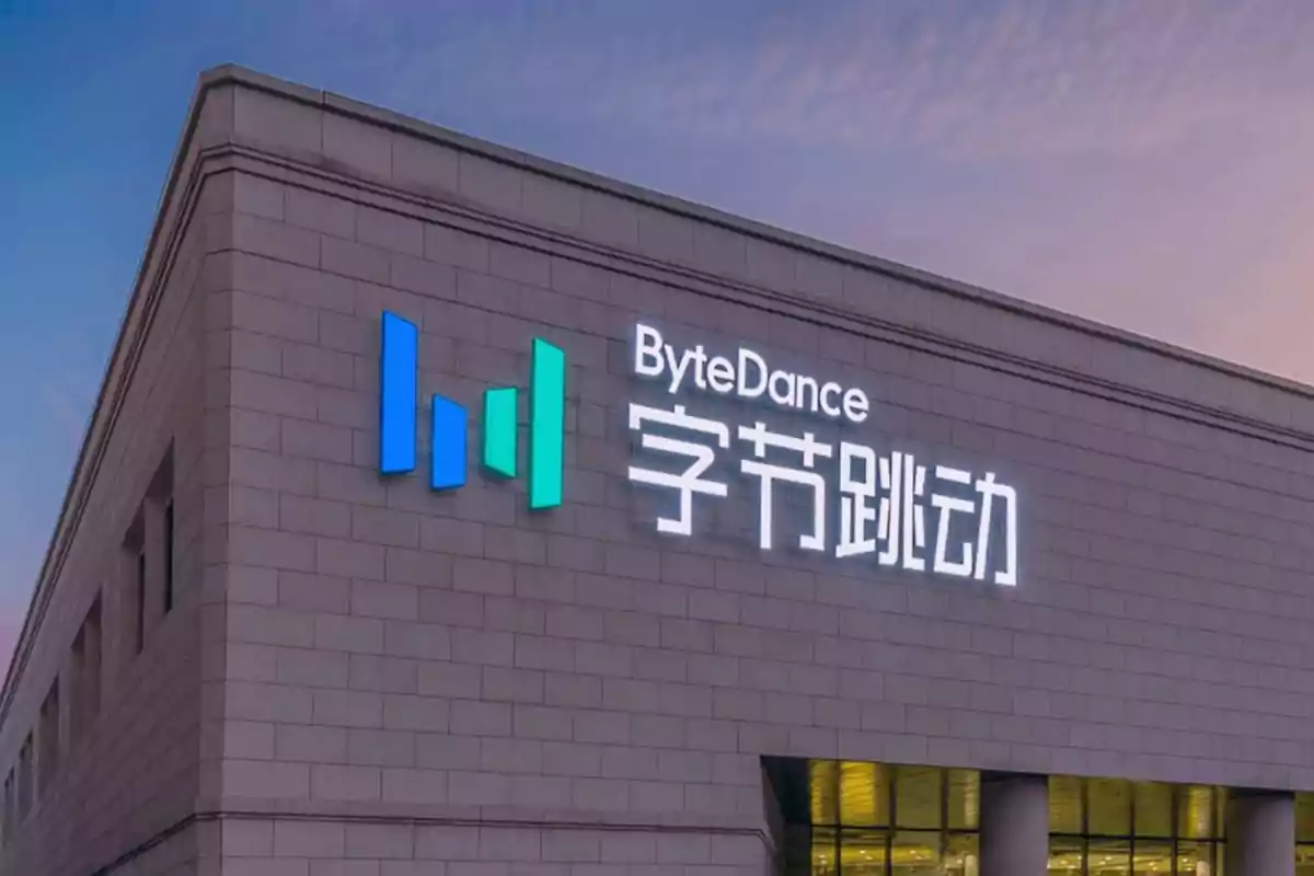 Stone building with the ByteDance logo and name illuminated next to Chinese characters at sunset