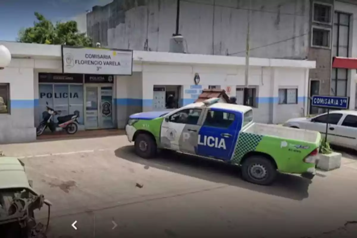 A police truck parked in front of a police station.