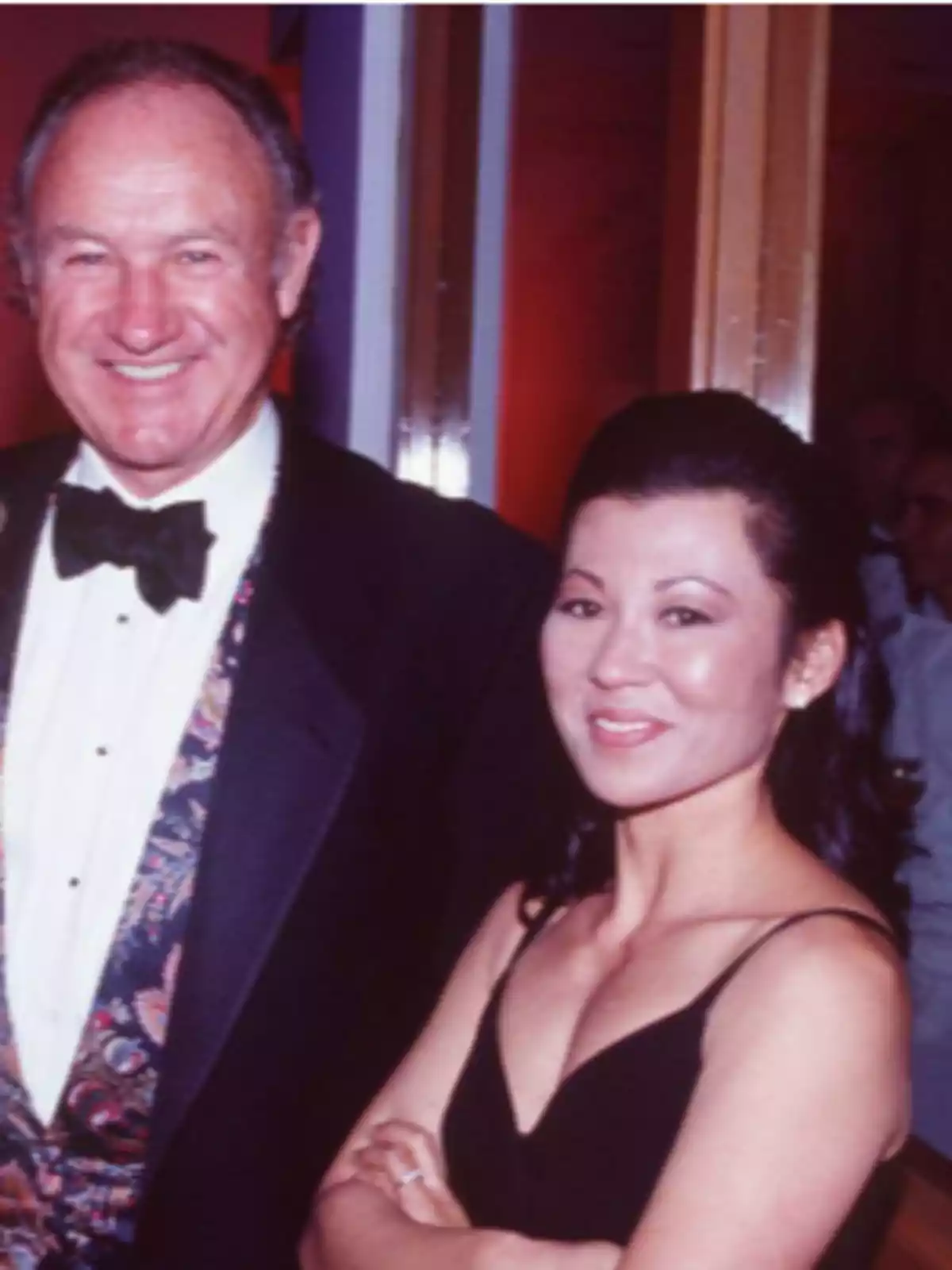Two people posing elegantly dressed at a formal event. Two people posing elegantly dressed at a formal event.
