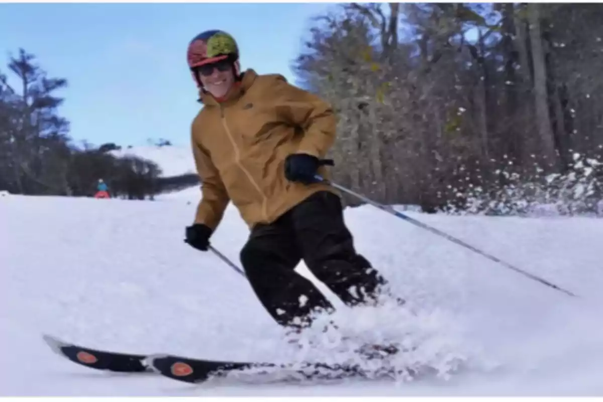 Person skiing on a snowy slope with trees in the background. Person skiing on a snowy slope with trees in the background.