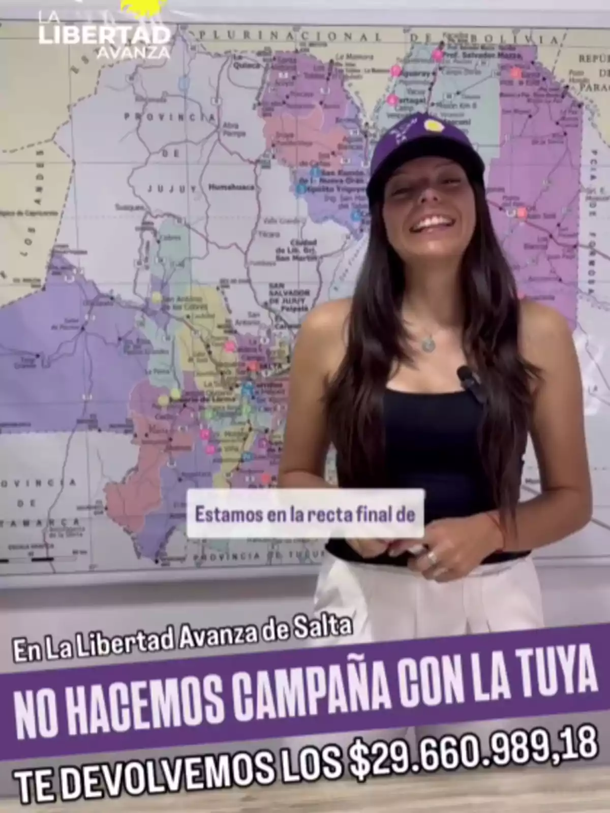 A smiling woman in a black cap and t-jersey is in front of a map, with text about political campaigns and money refunds. A smiling woman in a black cap and t-jersey is in front of a map, with text about political campaigns and money refunds.