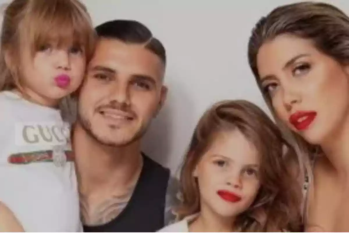Family posing together with two girls and two adults, all with red lipstick and a light background Family posing together with two girls and two adults, all with red lipstick and a light background