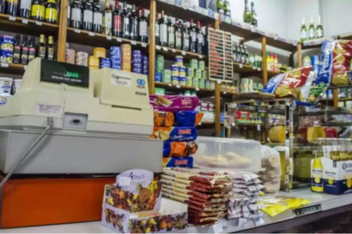Grocery store with an old cash register, shelves full of products, bottles, cans, snacks, and beer Grocery store with an old cash register, shelves full of products, bottles, cans, snacks, and beer