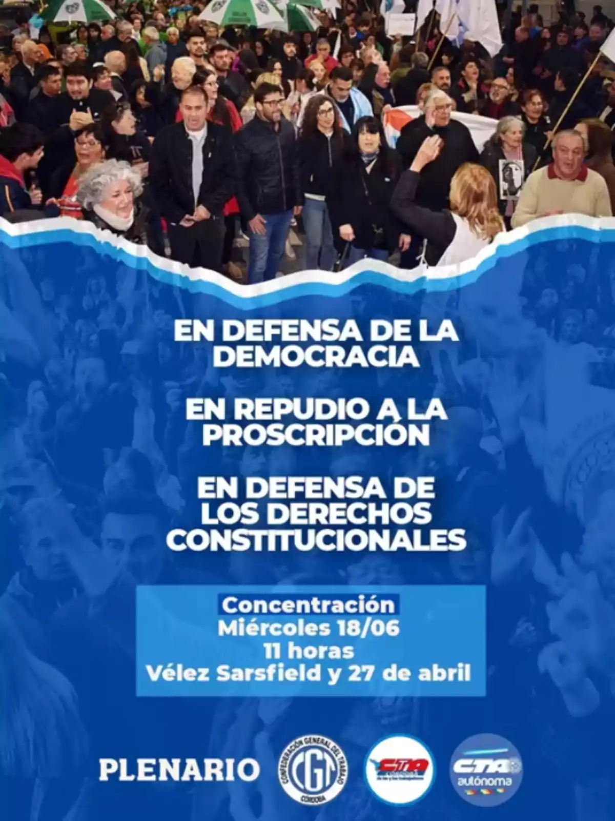 Un grupo numeroso de personas participa en una manifestación con pancartas y banderas, mientras en la parte inferior de la imagen se leen consignas en defensa de la democracia y los derechos constitucionales, junto con información sobre una concentración convocada por organizaciones sindicales. Un grupo numeroso de personas participa en una manifestación con pancartas y banderas, mientras en la parte inferior de la imagen se leen consignas en defensa de la democracia y los derechos constitucionales, junto con información sobre una concentración convocada por organizaciones sindicales.
