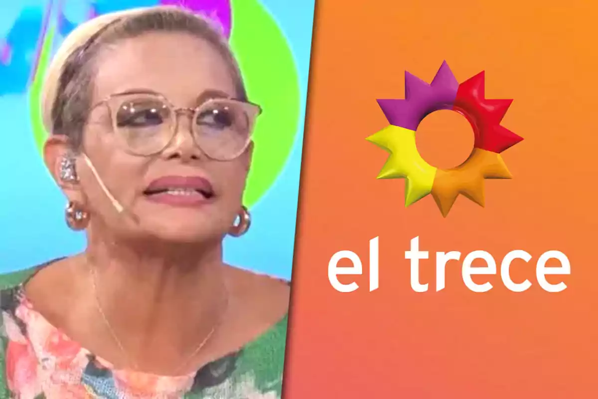 Una persona con gafas y micrófono en un programa de televisión junto al logo de "el trece" sobre un fondo colorido.