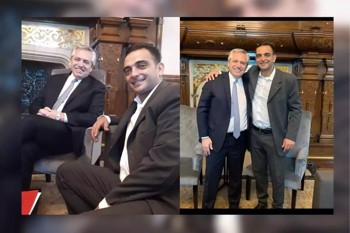 Dos hombres vestidos de traje posan juntos en una sala elegante con detalles de madera tallada y sillones grises, en una imagen aparecen sentados y en la otra de pie abrazados y sonriendo.