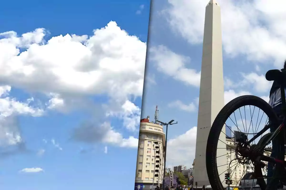 A split image shows on the left a blue sky with fluffy white clouds and on the right an urban obelisk with a bicycle in the foreground.
