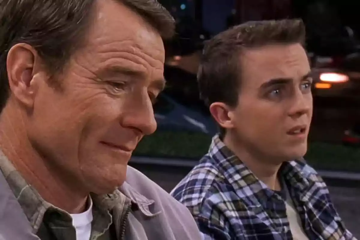 Two people sitting next to each other with serious and thoughtful expressions Two people sitting next to each other with serious and thoughtful expressions