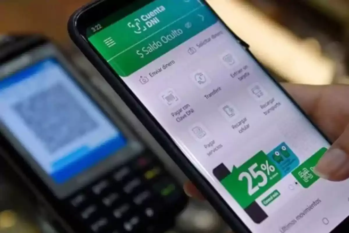 Person using a mobile banking app on a smartphone with a card reader in the background. Person using a mobile banking app on a smartphone with a card reader in the background.