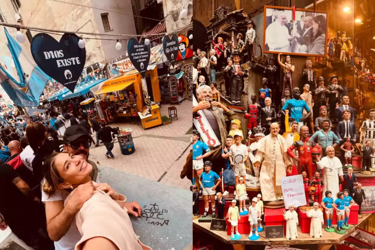 Una pareja sonríe mientras se toma una selfie en una calle llena de banderas y carteles, mientras que a la derecha se exhiben figuras de personajes famosos en una tienda. Una pareja sonríe mientras se toma una selfie en una calle llena de banderas y carteles, mientras que a la derecha se exhiben figuras de personajes famosos en una tienda.