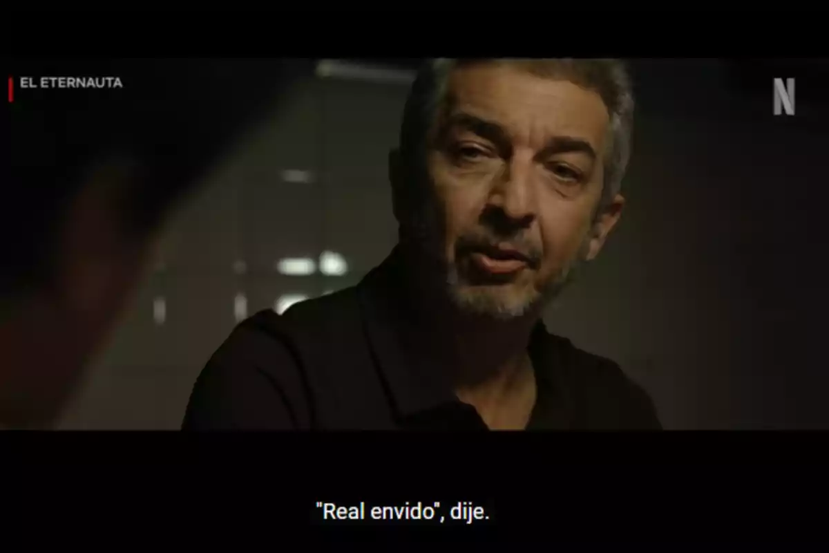 A gray-haired man with a beard is speaking in a scene from the series A gray-haired man with a beard is speaking in a scene from the series
