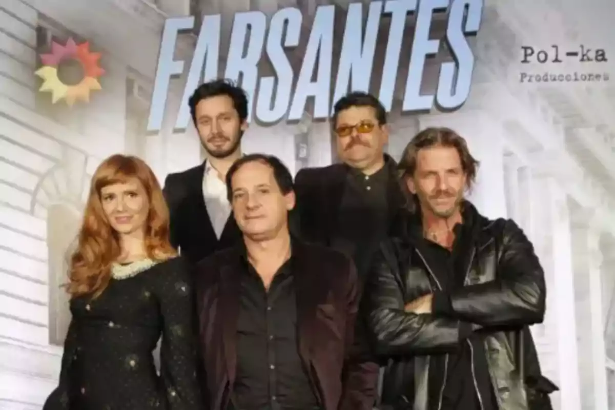 A group of people posing in front of a sign that says A group of people posing in front of a sign that says