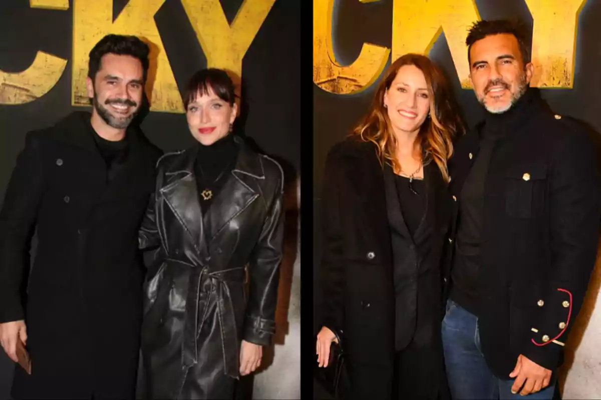 Two couples pose smiling in front of a black background with large yellow letters, all dressed in dark clothing and elegant coats. Two couples pose smiling in front of a black background with large yellow letters, all dressed in dark clothing and elegant coats.