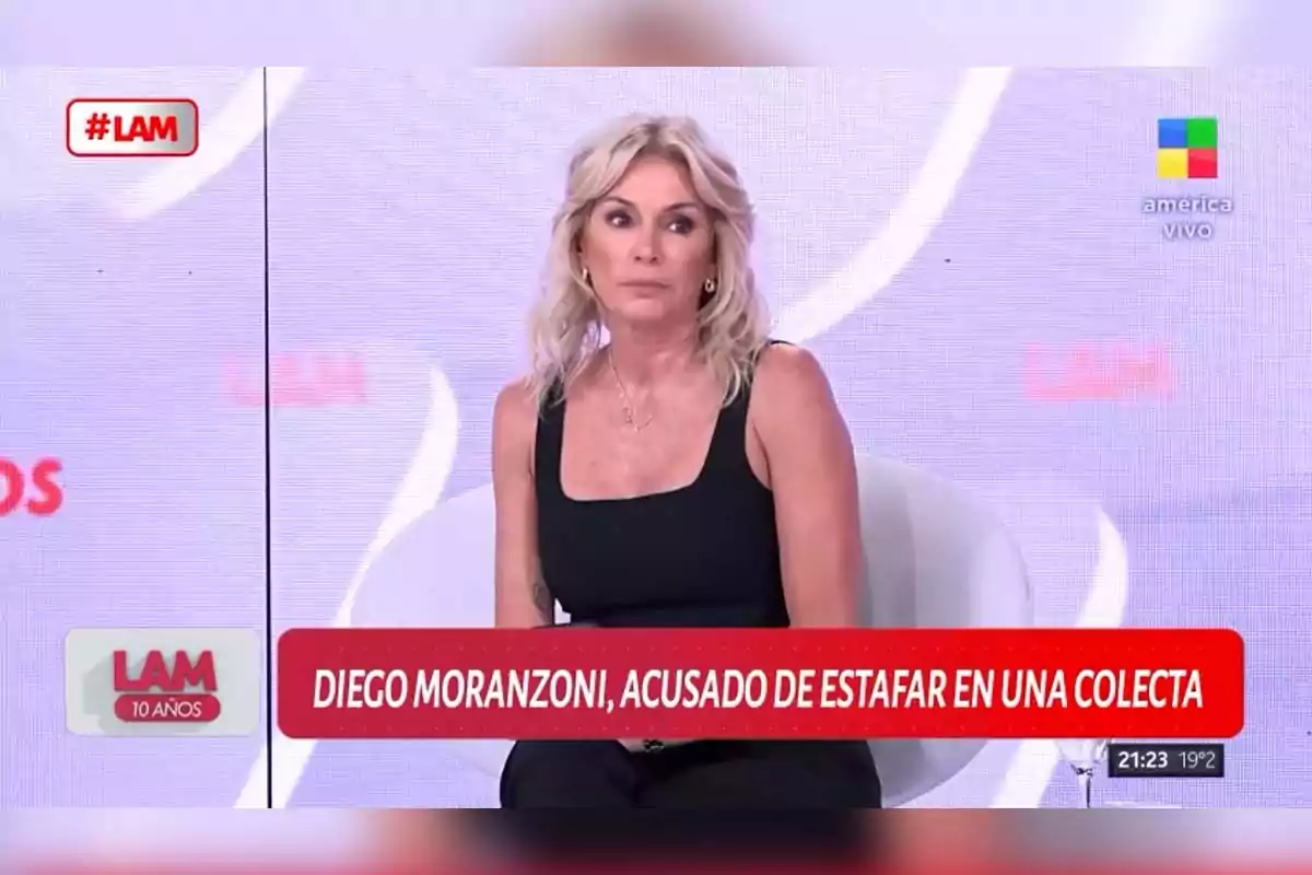 Blonde woman sitting on a TV show with an on-screen sign mentioning a scam accusation in a fundraiser. Blonde woman sitting on a TV show with an on-screen sign mentioning a scam accusation in a fundraiser.