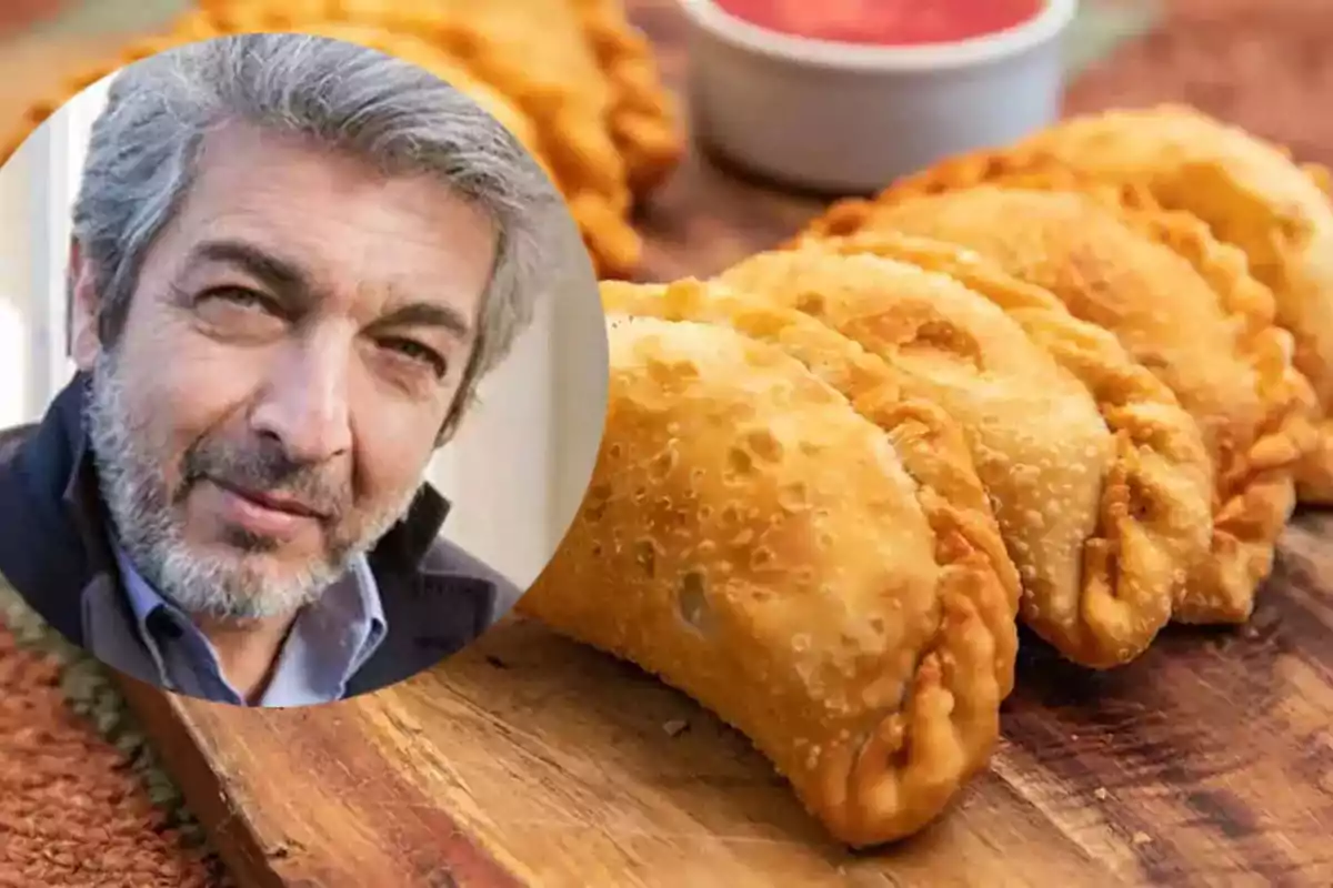 A gray-haired, bearded man appears in an overlapping circle over a wooden board with several golden empanadas and a sauce in the background.