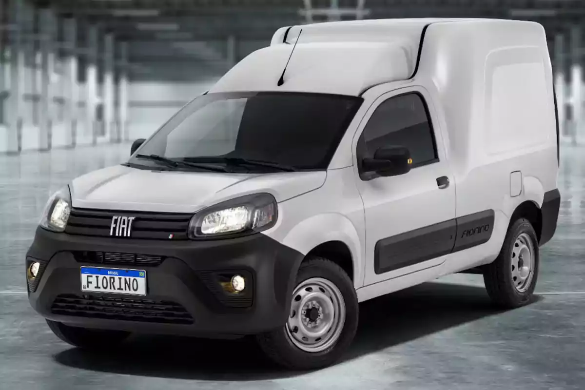 White Fiat Fiorino van parked in an enclosed industrial space White Fiat Fiorino van parked in an enclosed industrial space