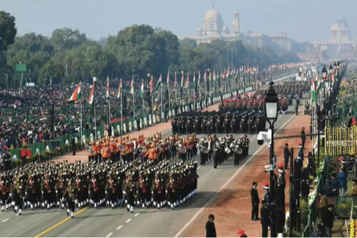 Military parade with bands and soldiers marching on an avenue flanked by flags and spectators, with monumental buildings in the background. Military parade with bands and soldiers marching on an avenue flanked by flags and spectators, with monumental buildings in the background.