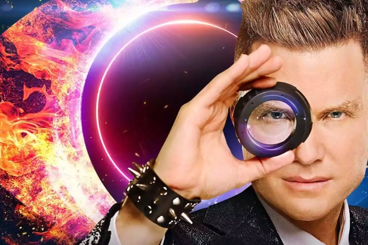 A man with a spiked bracelet holds a lens in front of his eye while a background of eclipse and flames highlights behind him. A man with a spiked bracelet holds a lens in front of his eye while a background of eclipse and flames highlights behind him.