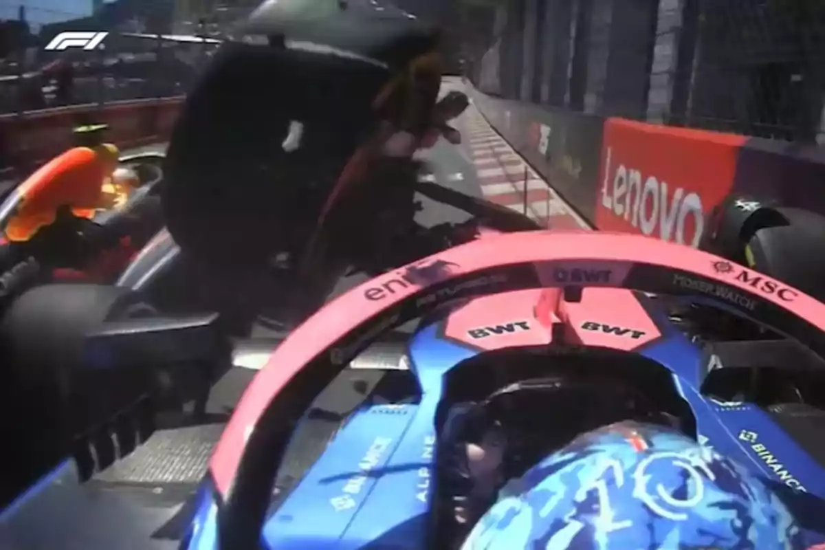 A Formula 1 car in a collision during a race on a street circuit. A Formula 1 car in a collision during a race on a street circuit.
