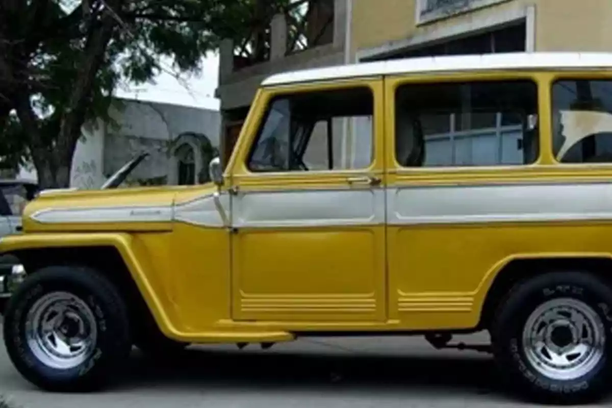 A classic yellow and white vehicle parked on a street. A classic yellow and white vehicle parked on a street.