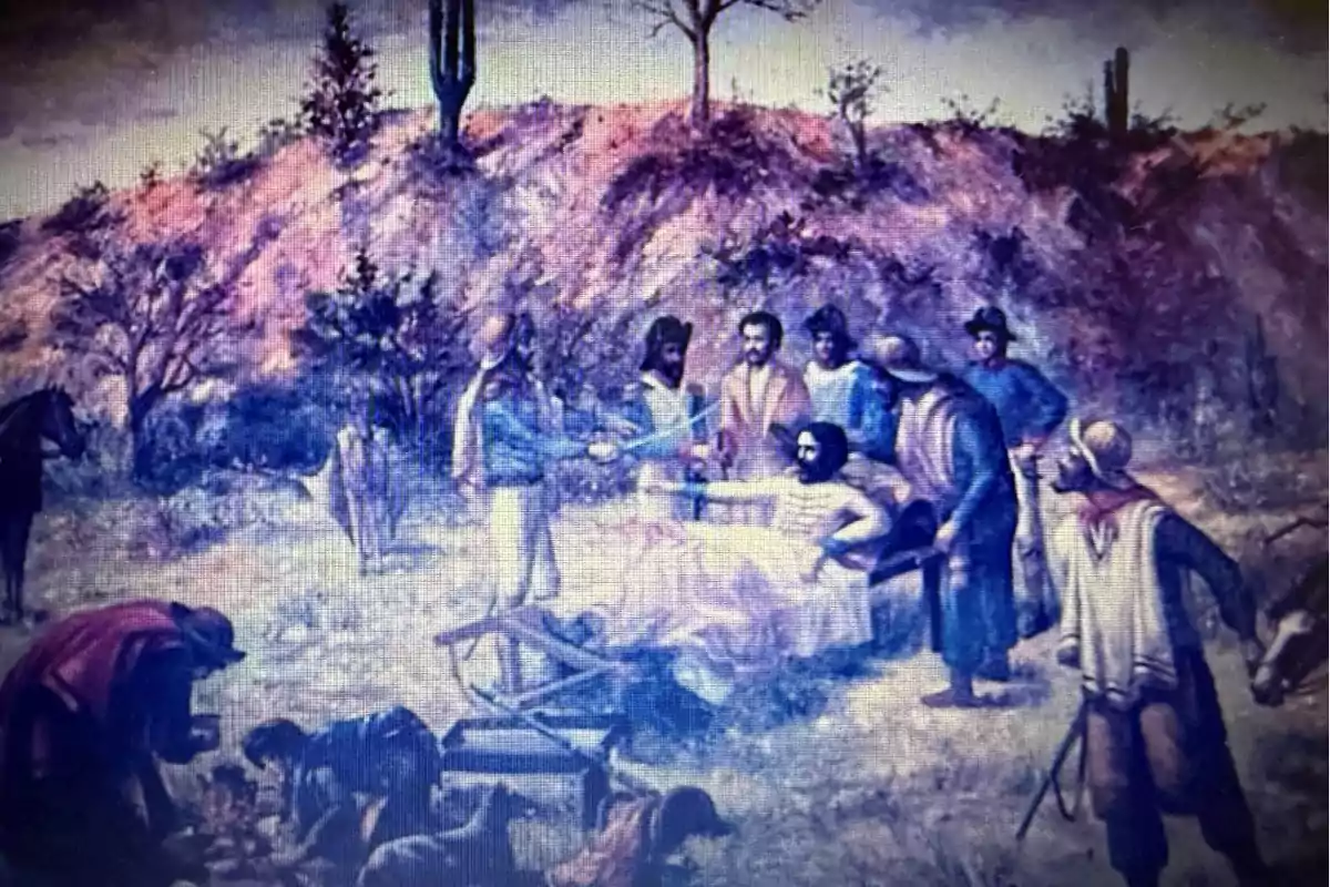 Pintura que muestra a un grupo de personas reunidas alrededor de un hombre herido recostado en una camilla en un paisaje árido con cactus y vegetación seca Pintura que muestra a un grupo de personas reunidas alrededor de un hombre herido recostado en una camilla en un paisaje árido con cactus y vegetación seca
