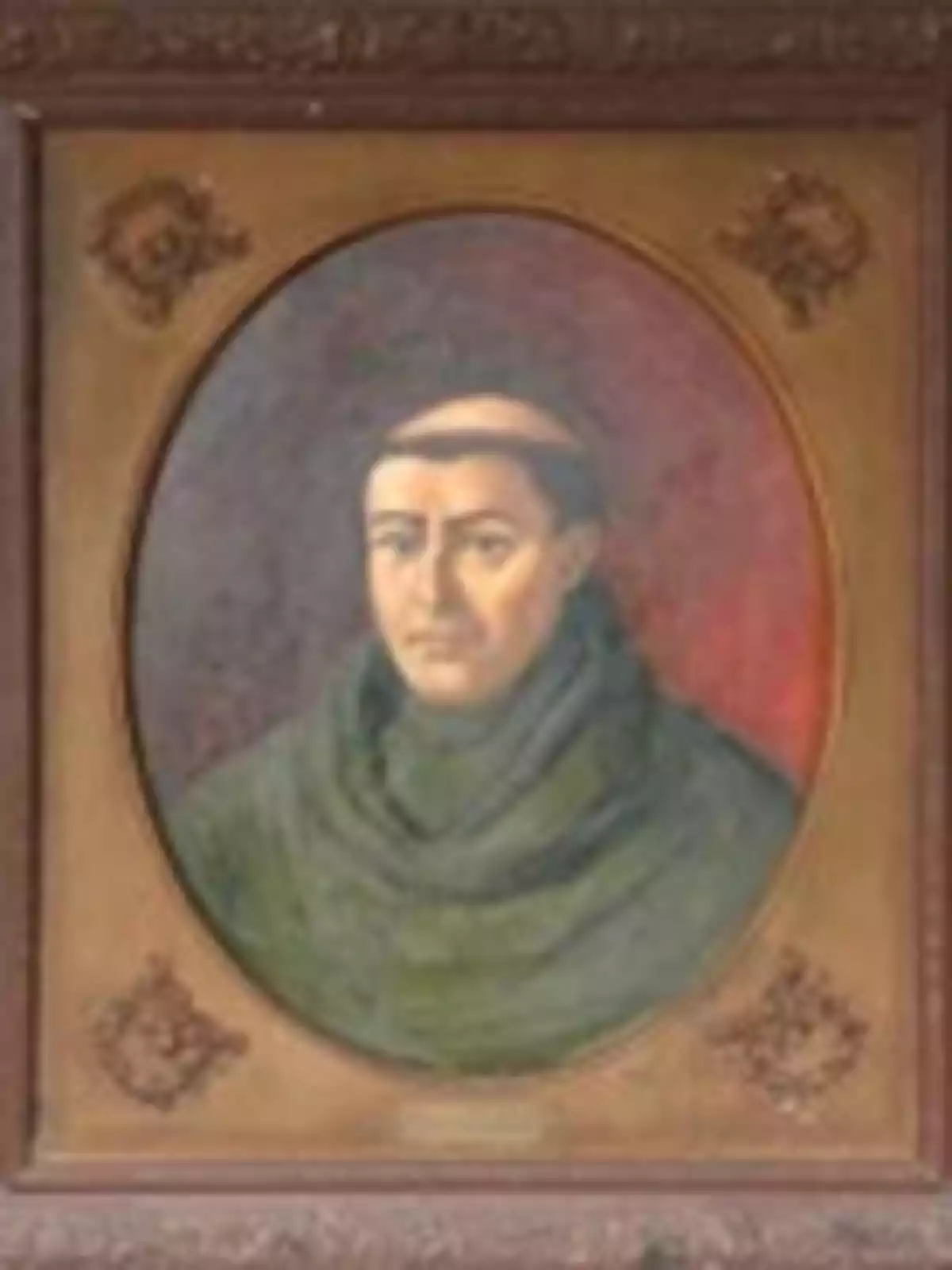 Retrato de un monje con hábito verde y tonsura, enmarcado en un marco decorativo. Retrato de un monje con hábito verde y tonsura, enmarcado en un marco decorativo.