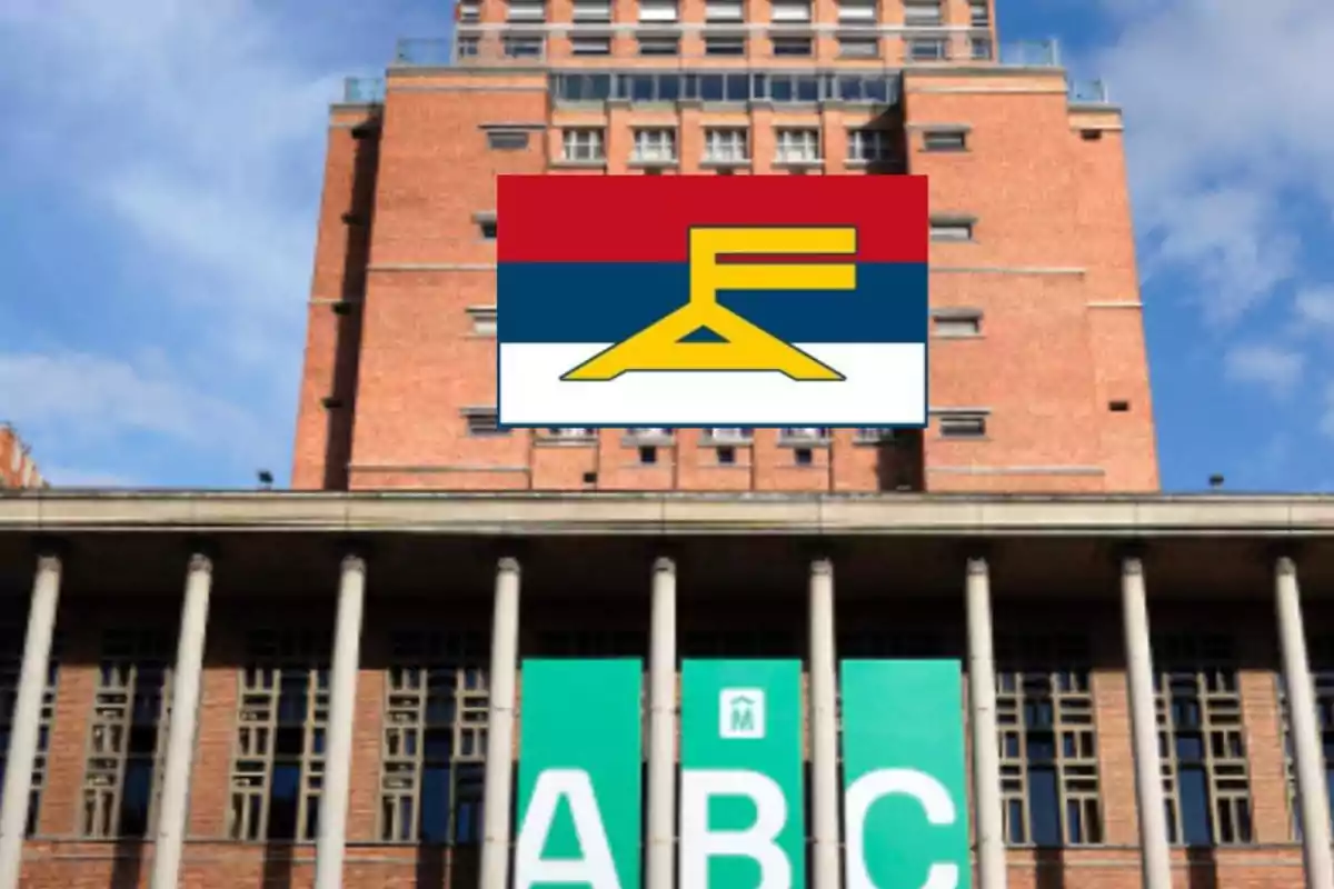 Brick building with columns and a green sign with the letters ABC, over which a flag with red, blue, and white stripes and a yellow symbol is superimposed.