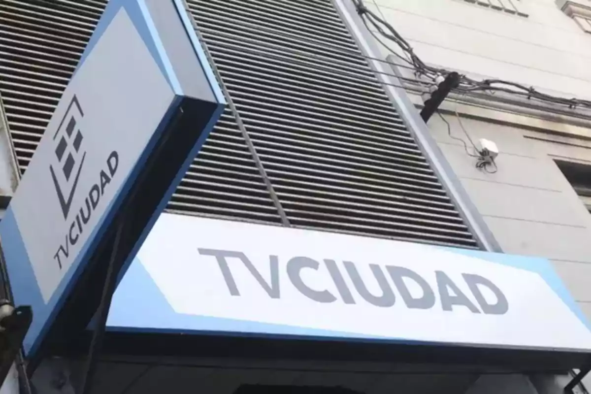 A TVCIUDAD sign on the facade of a building.