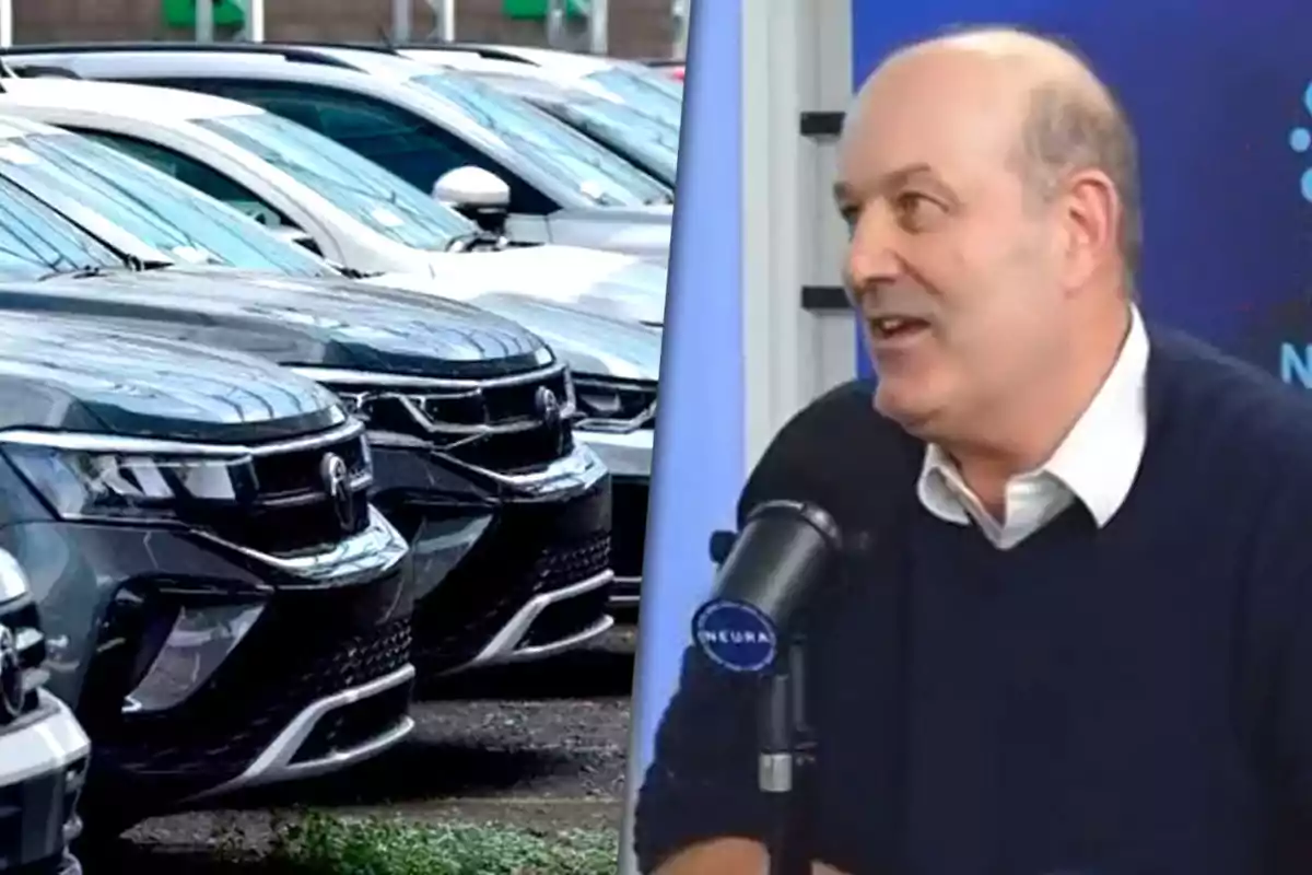 Several new cars parked next to a man speaking in front of a microphone in a radio studio.