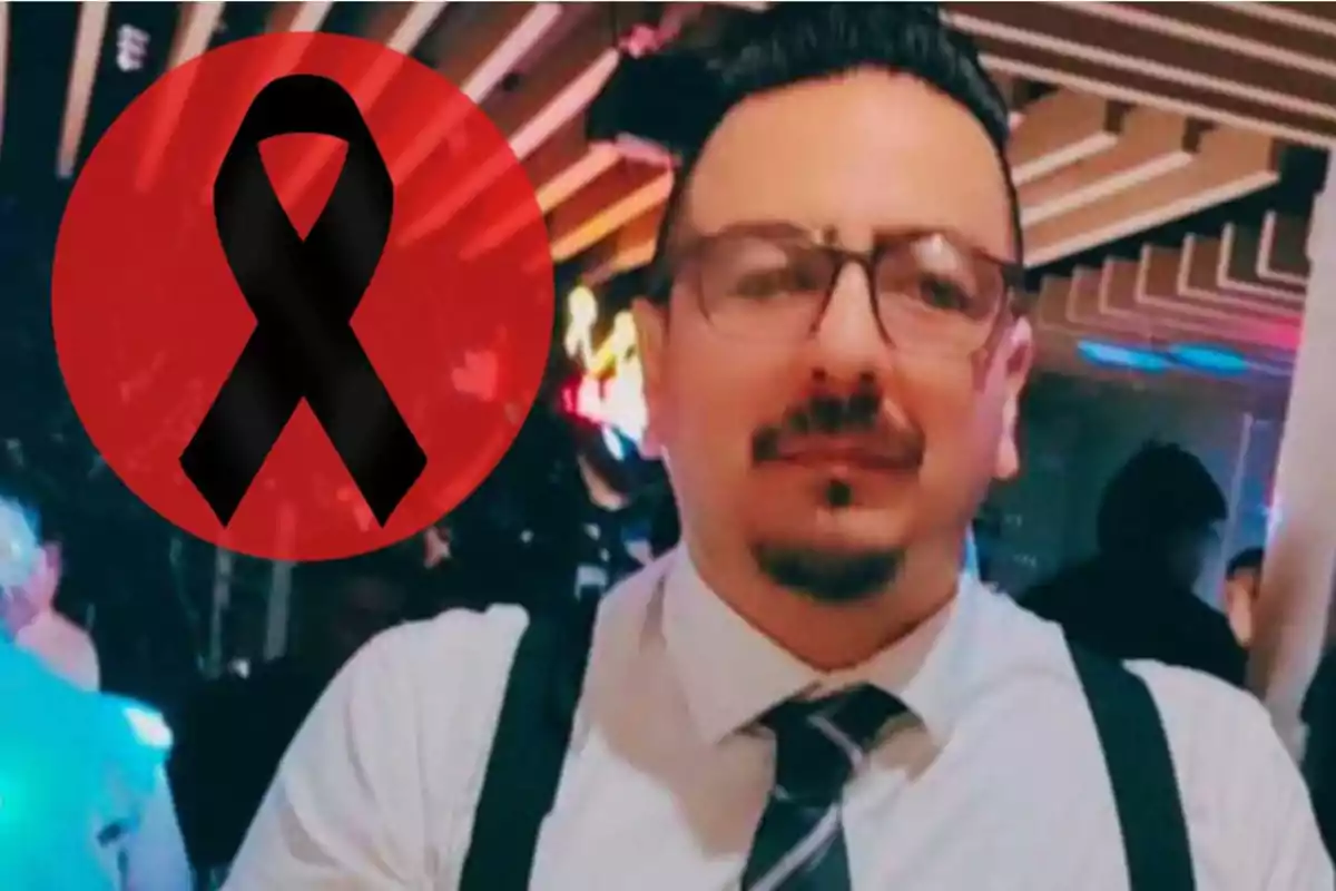 A man with glasses and a tie in an indoor setting with a black bow tie on a red background beside him.