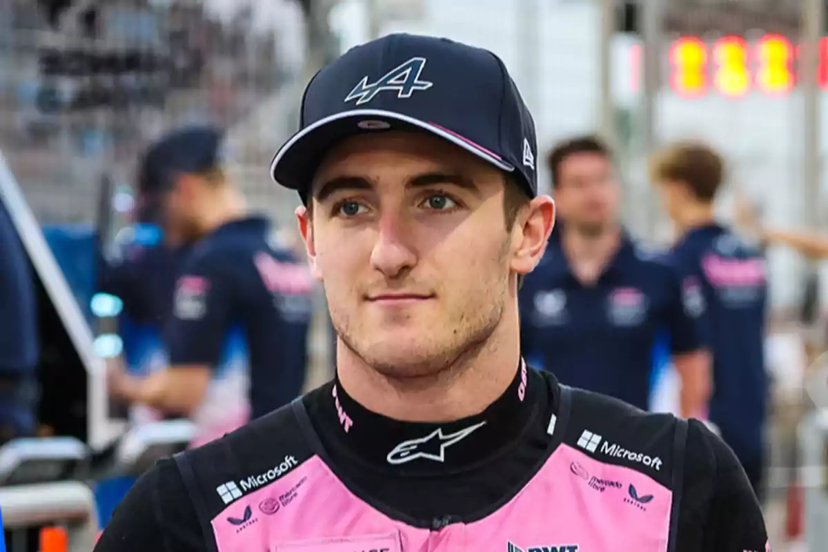 A man with a cap and racing uniform in a competitive setting. A man with a cap and racing uniform in a competitive setting.