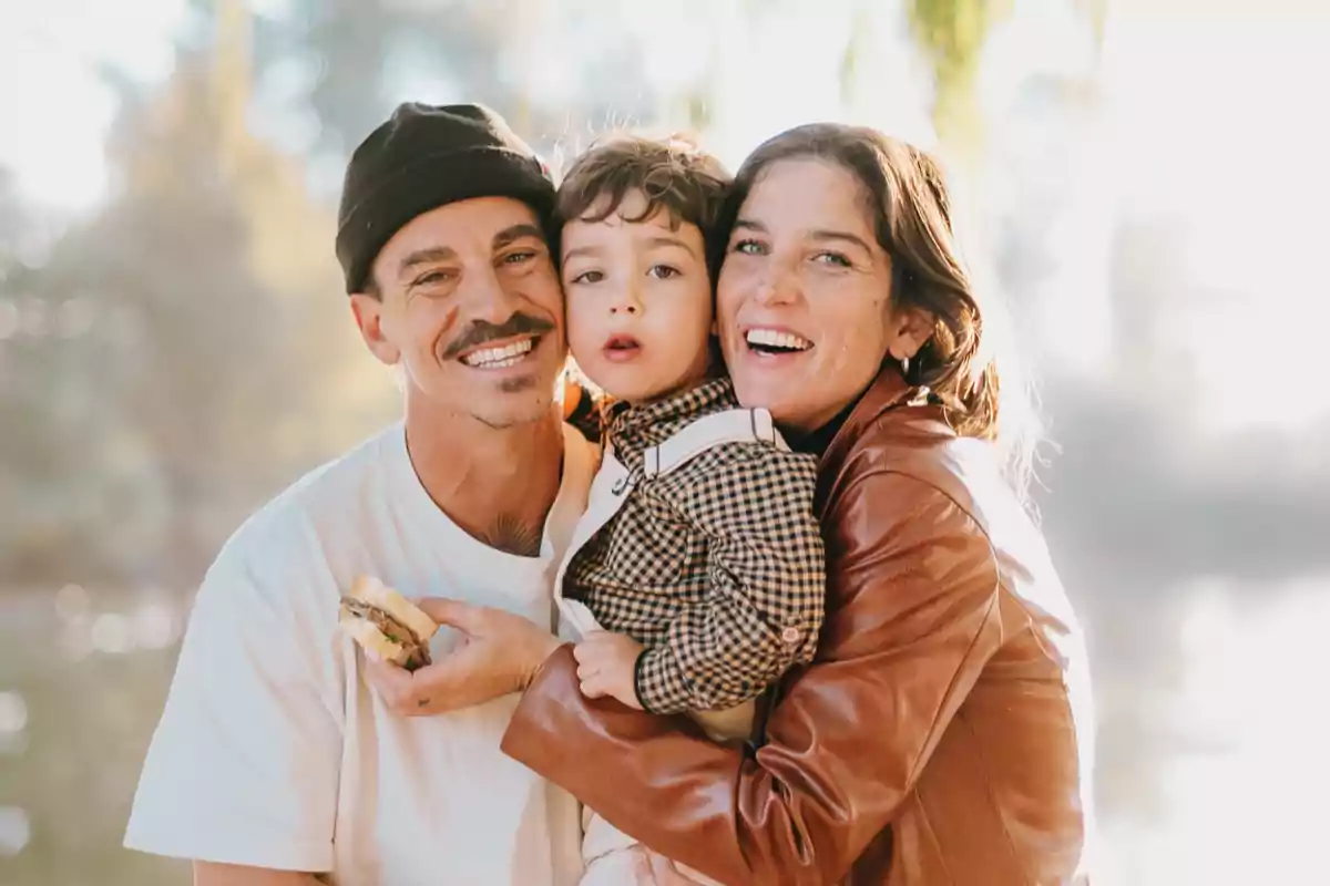 A smiling family enjoying a day outdoors.
