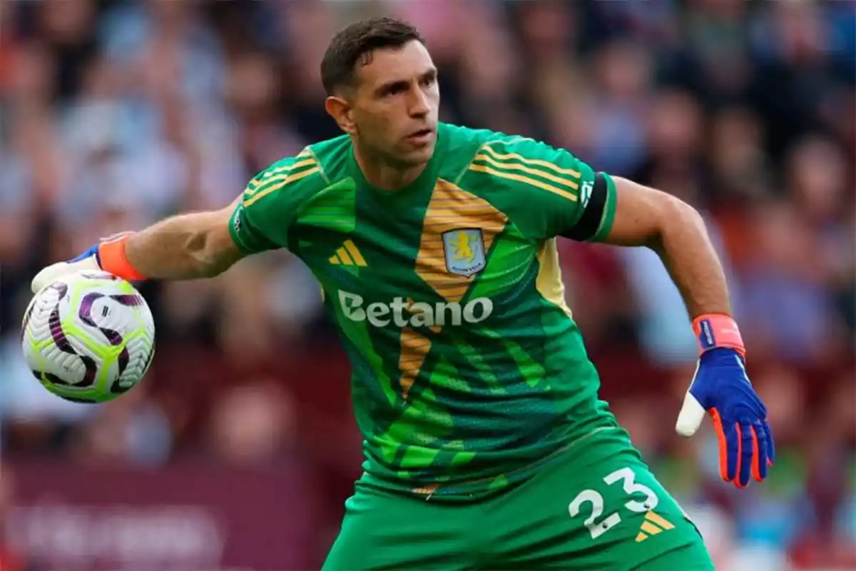 Soccer goalkeeper in a green uniform and gloves holding a ball during a match Soccer goalkeeper in a green uniform and gloves holding a ball during a match