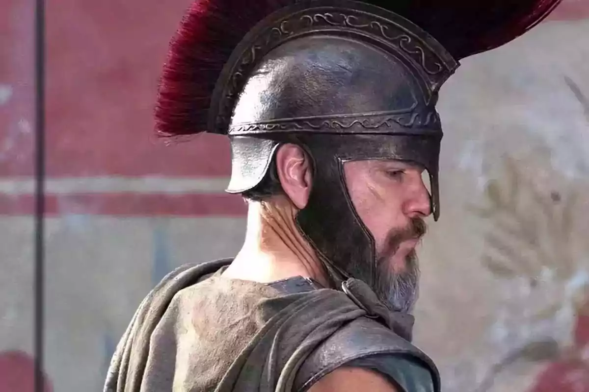 A man with an ancient warrior helmet and armor, looking to the side. A man with an ancient warrior helmet and armor, looking to the side.