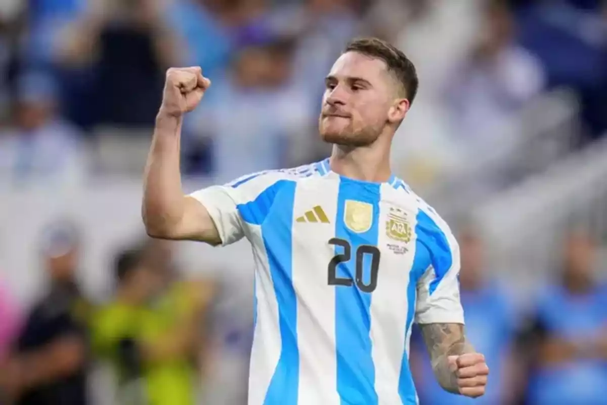 Argentinian player in the national team uniform celebrating with a raised fist during a match