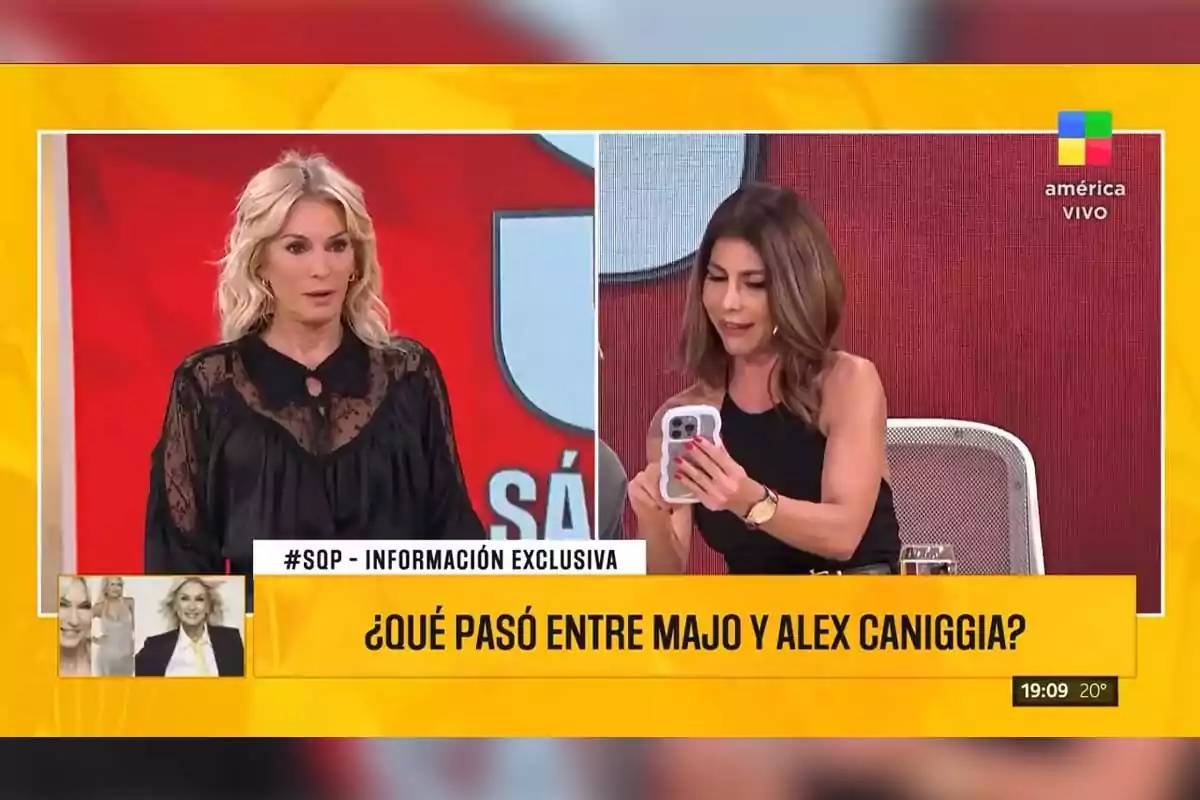 Dos mujeres en un programa de televisión en vivo, una de ellas está de pie con expresión seria y la otra está sentada mirando su teléfono, con un gráfico en pantalla que pregunta sobre un tema de interés. Dos mujeres en un programa de televisión en vivo, una de ellas está de pie con expresión seria y la otra está sentada mirando su teléfono, con un gráfico en pantalla que pregunta sobre un tema de interés.