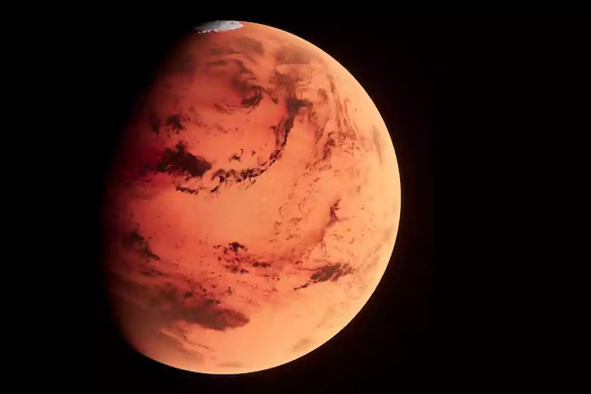 Planeta Marte visto desde el espacio con su superficie rojiza y detalles de sombras y luces. Planeta Marte visto desde el espacio con su superficie rojiza y detalles de sombras y luces.