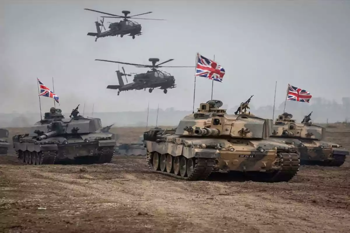 Tanques y helicópteros militares británicos en un campo de entrenamiento.