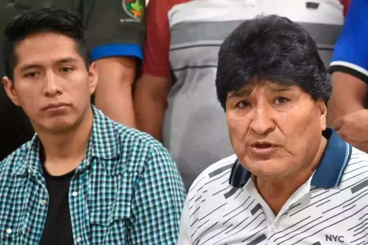 Dos hombres sentados, uno con camisa a cuadros y el otro con camiseta blanca con detalles oscuros, en un entorno de reunión. Dos hombres sentados, uno con camisa a cuadros y el otro con camiseta blanca con detalles oscuros, en un entorno de reunión.