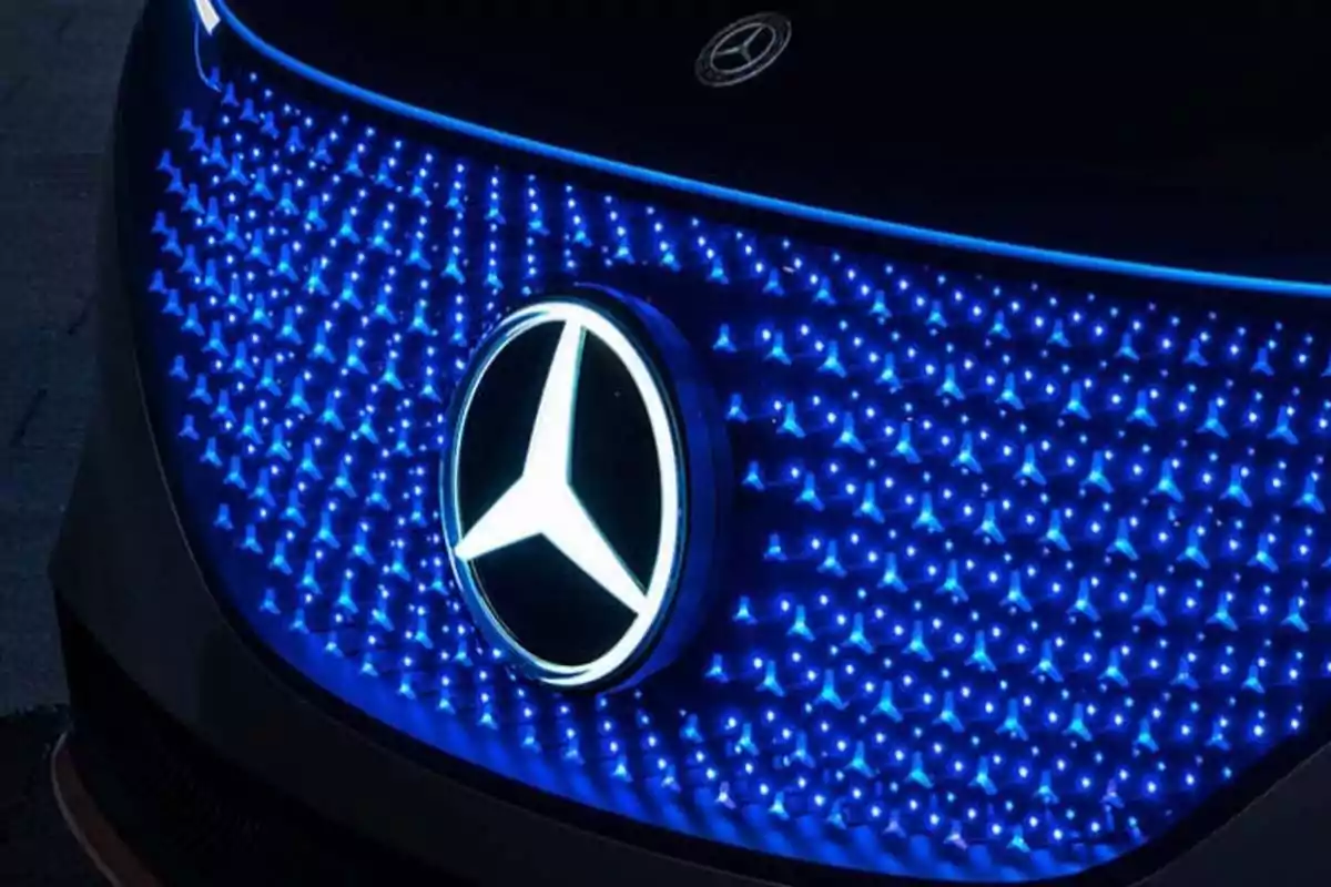 Front of a Mercedes-Benz car with an illuminated logo and a grille decorated with blue LED lights Front of a Mercedes-Benz car with an illuminated logo and a grille decorated with blue LED lights