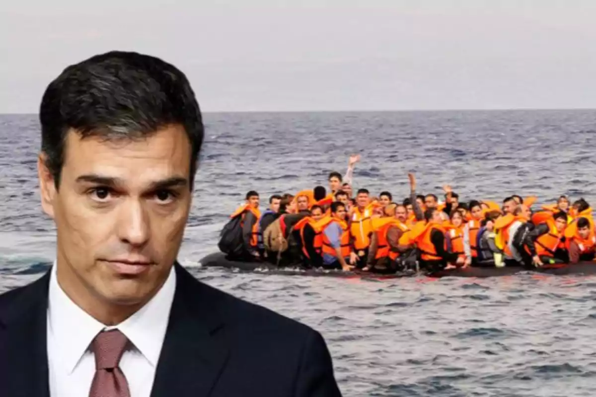 A man in a suit and tie appears in the foreground while a group of people in life jackets is on a boat in the sea in the background.