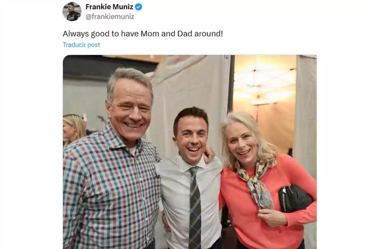 Three people smile and pose together for a photo; one is wearing a plaid jersey, another a white jersey with a tie, and the third a pink sweater with a colorful scarf. Three people smile and pose together for a photo; one is wearing a plaid jersey, another a white jersey with a tie, and the third a pink sweater with a colorful scarf.