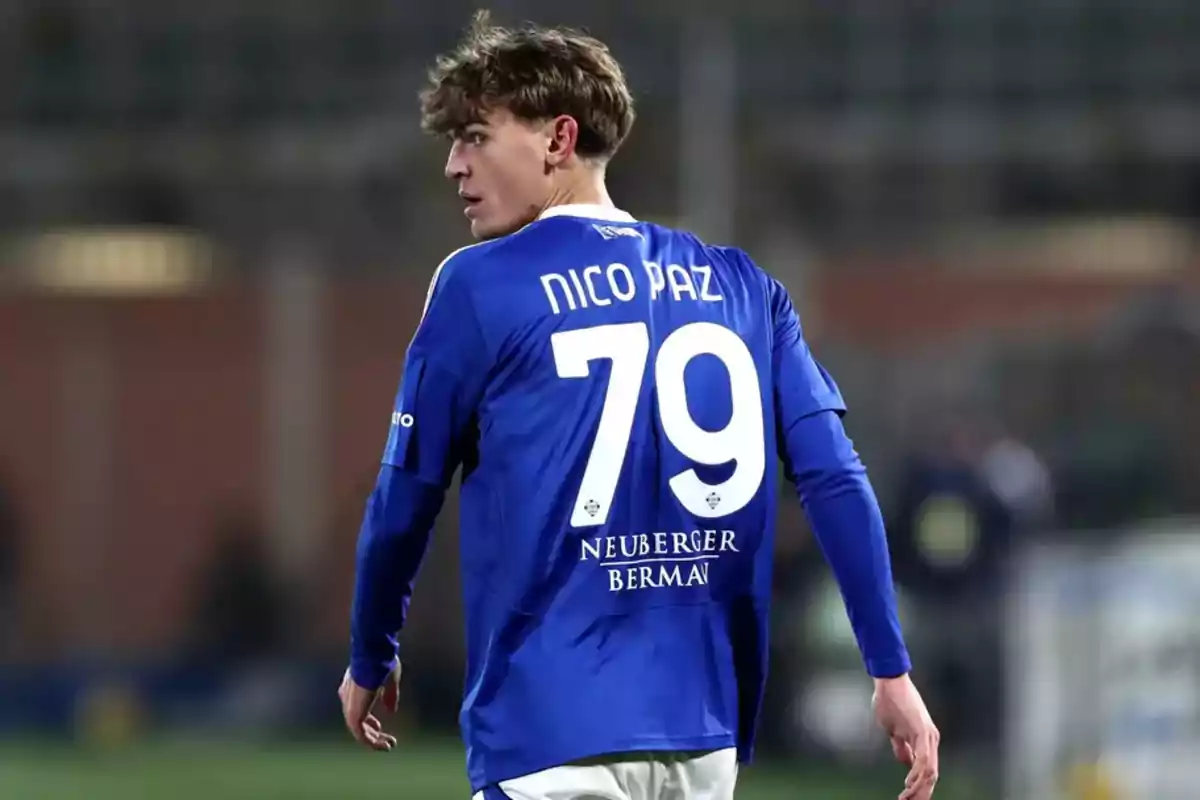 Soccer player wearing a blue jersey with the number 79 on the back during a game Soccer player wearing a blue jersey with the number 79 on the back during a game