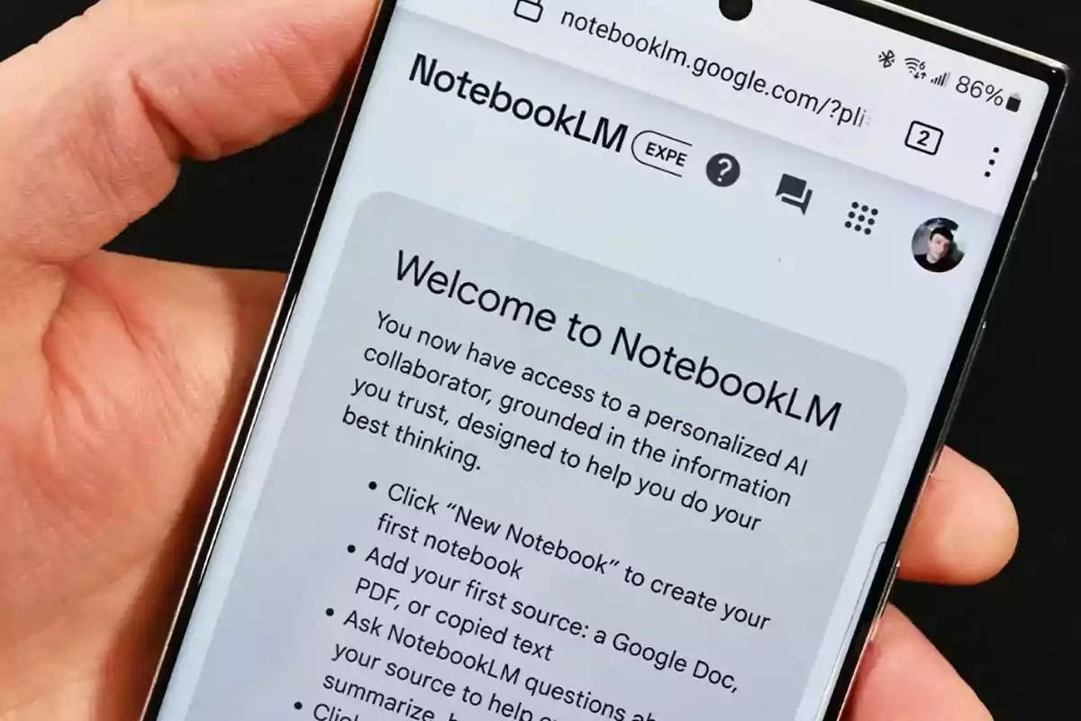 A hand holds a mobile phone displaying a welcome webpage for NotebookLM, a personalized artificial intelligence collaborator. A hand holds a mobile phone displaying a welcome webpage for NotebookLM, a personalized artificial intelligence collaborator.