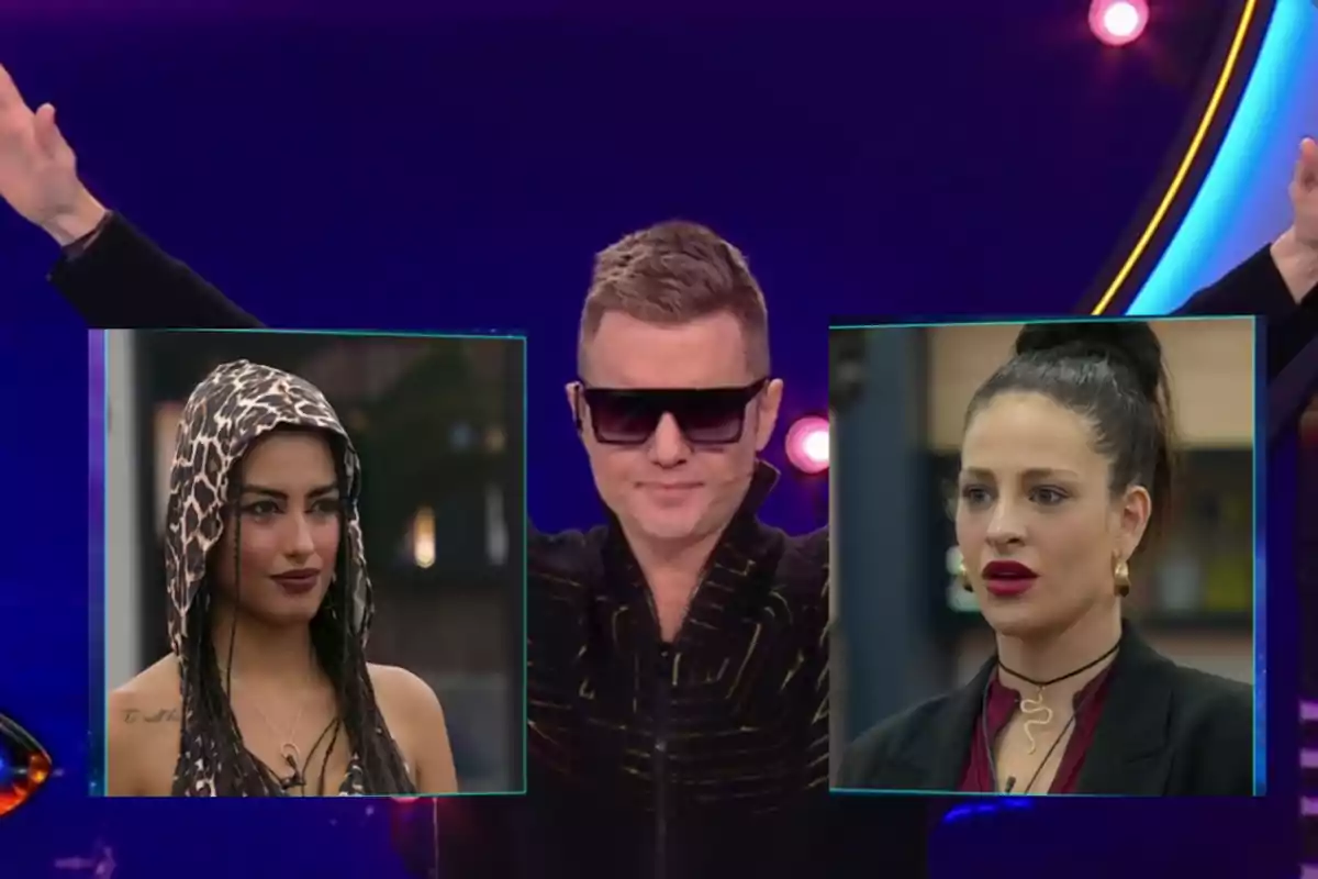 A host with sunglasses raises his arms while two women appear in boxes beside him, one with an animal print hoodie and the other with her hair tied up.