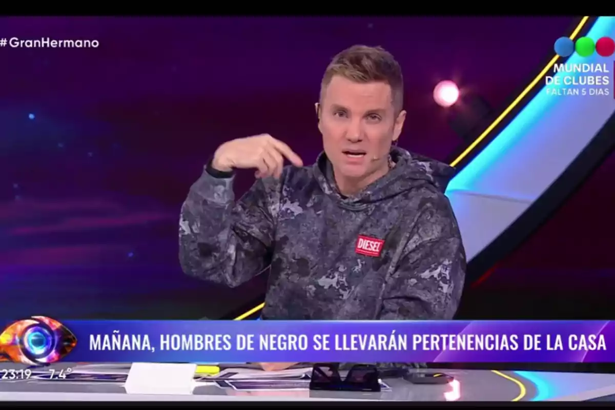 TV host speaking on a show with a graphic announcing that tomorrow men in black will take belongings from the house TV host speaking on a show with a graphic announcing that tomorrow men in black will take belongings from the house